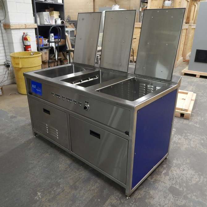 Bluewave sanitizing machines with lids open