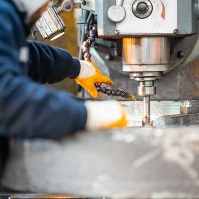 arms working on industrial machine